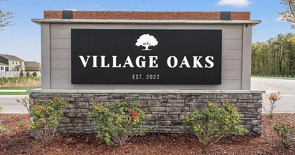 Village Oaks community entrance sign — Goal Line Mowing lawn care in Myrtle Beach SC